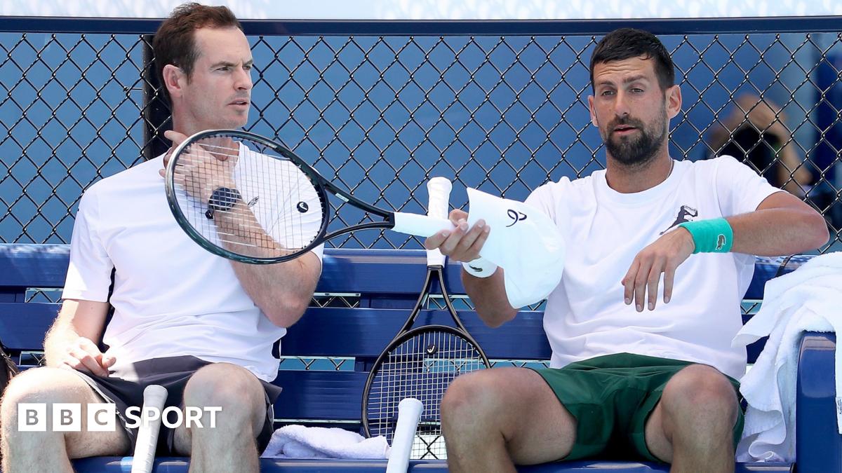 Andy Murray speaks to Novak Djokovic during the Australian Open