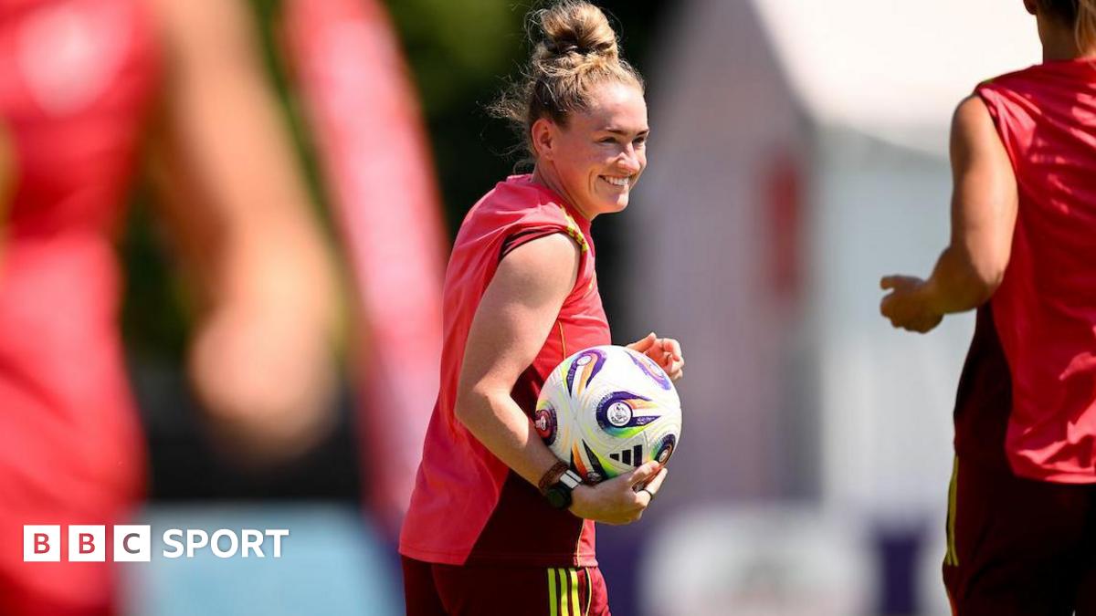 Rachel Rowe smiles and holds the ball as she trains with Wales in Switzerland during Euro 2025